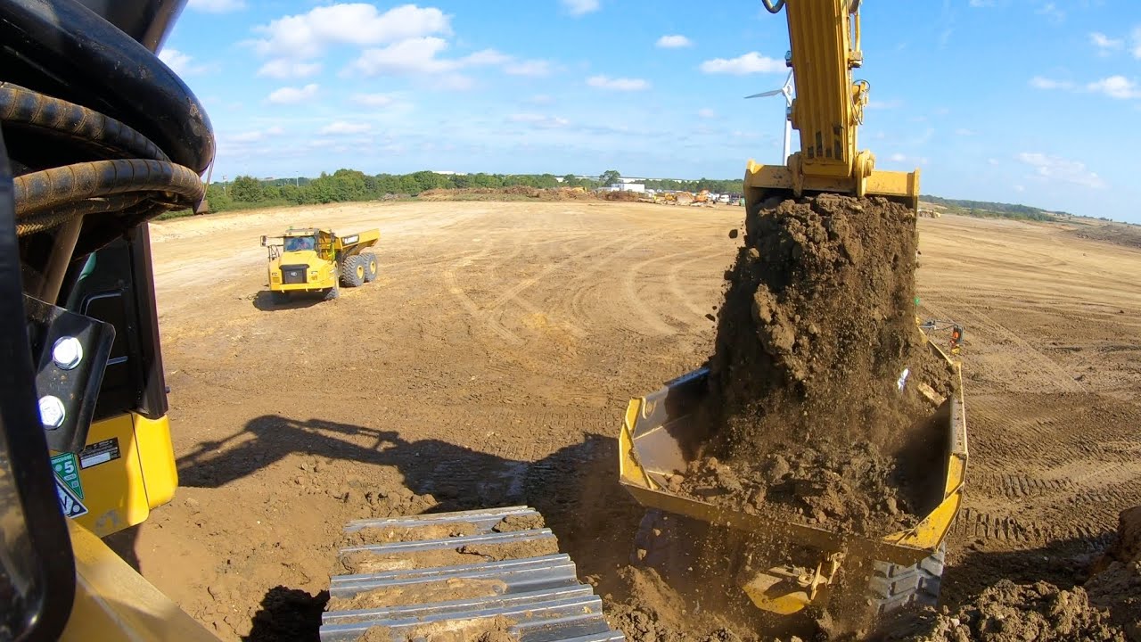 New Cat 374 Loading Trucks