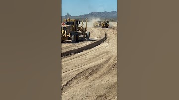 Finishing side walk along with a 623 scraper #construction