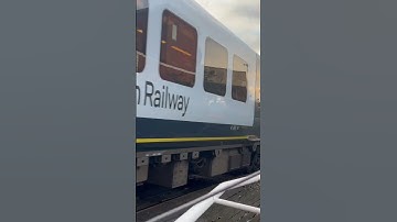 SWR 444 032 departing across level crossing at Poole Station 01/03/23