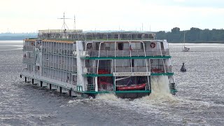Modern River Cruise Vessel with Paddle Wheels