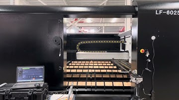 the machine is performing XY-axis precision compensation using a laser interferometer.2