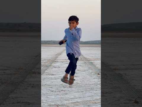 Cute kid is running in white Rann of kutch