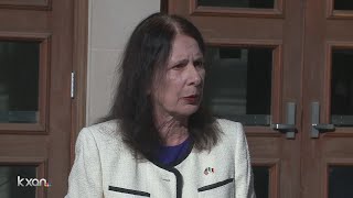 Professor suing UT over pay gap speaks outside law school