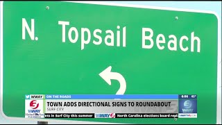 Surf City adds directional signs to roundabout.