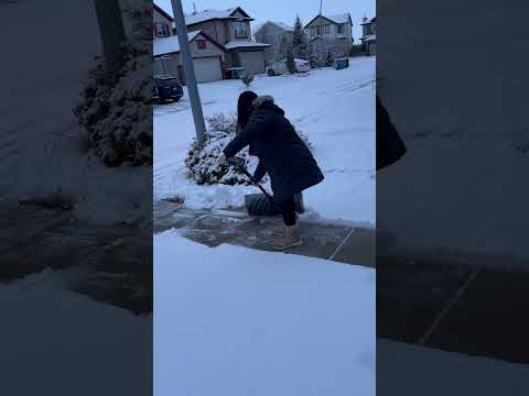 Filipina Shovels Snow First Time 