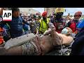 US rescue workers pull father and son from rubble after Venezuela earthquakes