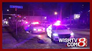Woman dies and a person was in custody after a shooting near downtown Indianapolis