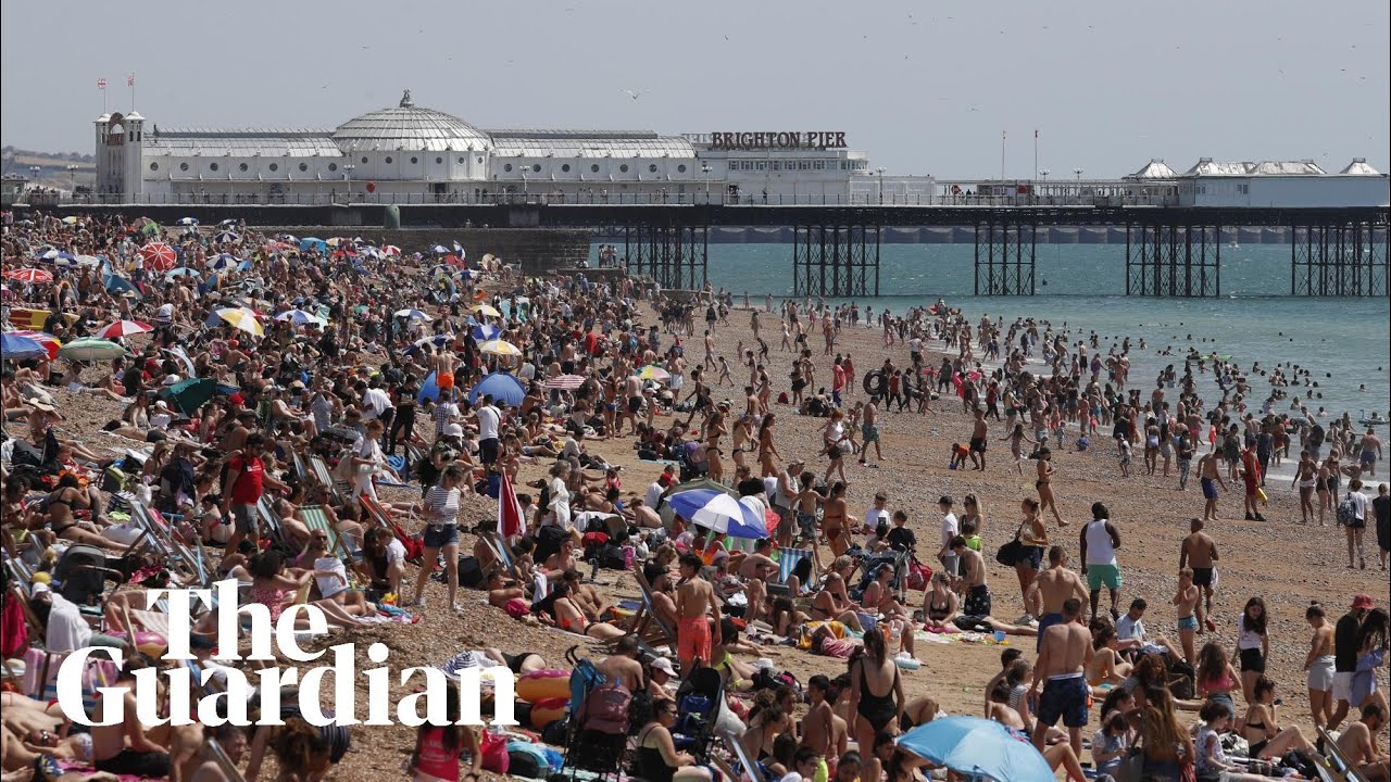 Sunbathers pack English beaches despite lockdown warning