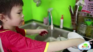 Baby Xavi learning wash the dishes first time