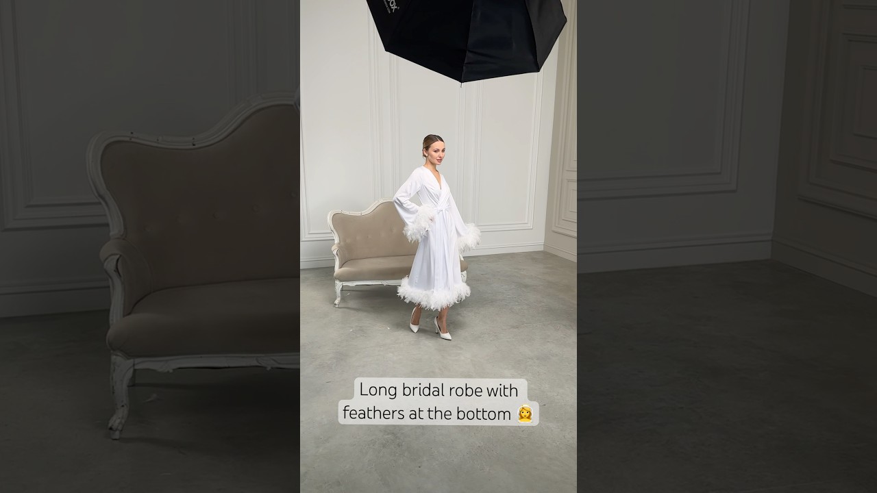 Long bridal robe with feathers at the bottom // belladonnaua.com 