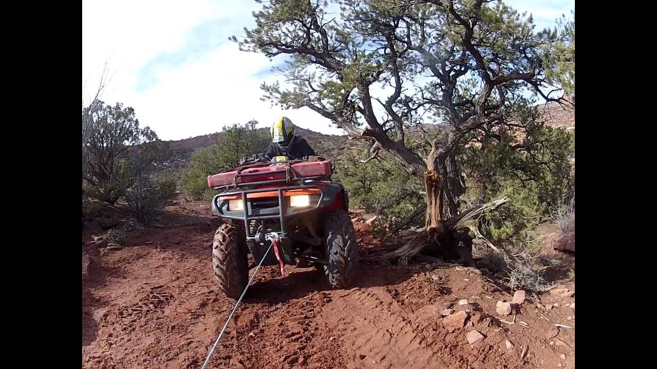 Towing Trish on her 2wd Honda Rancher 350 over an obstacle Porcupine