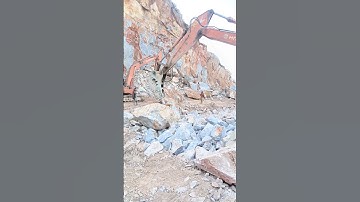 "Excavator Crushing Rock — Extreme Power in Action!"