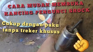 cara buka kancing pengunci shock depan tanpa treker