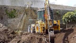 Désouchage avec new holland b 110 c .