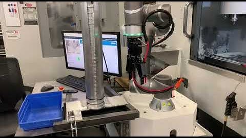 Cobot opening m/c tending doors.