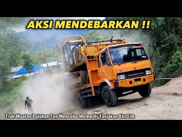 Aksi Mendebarkan Sopir Truck Muatan Excavator Menjajal Tanjakan Ekstrim Batu Jomba class=