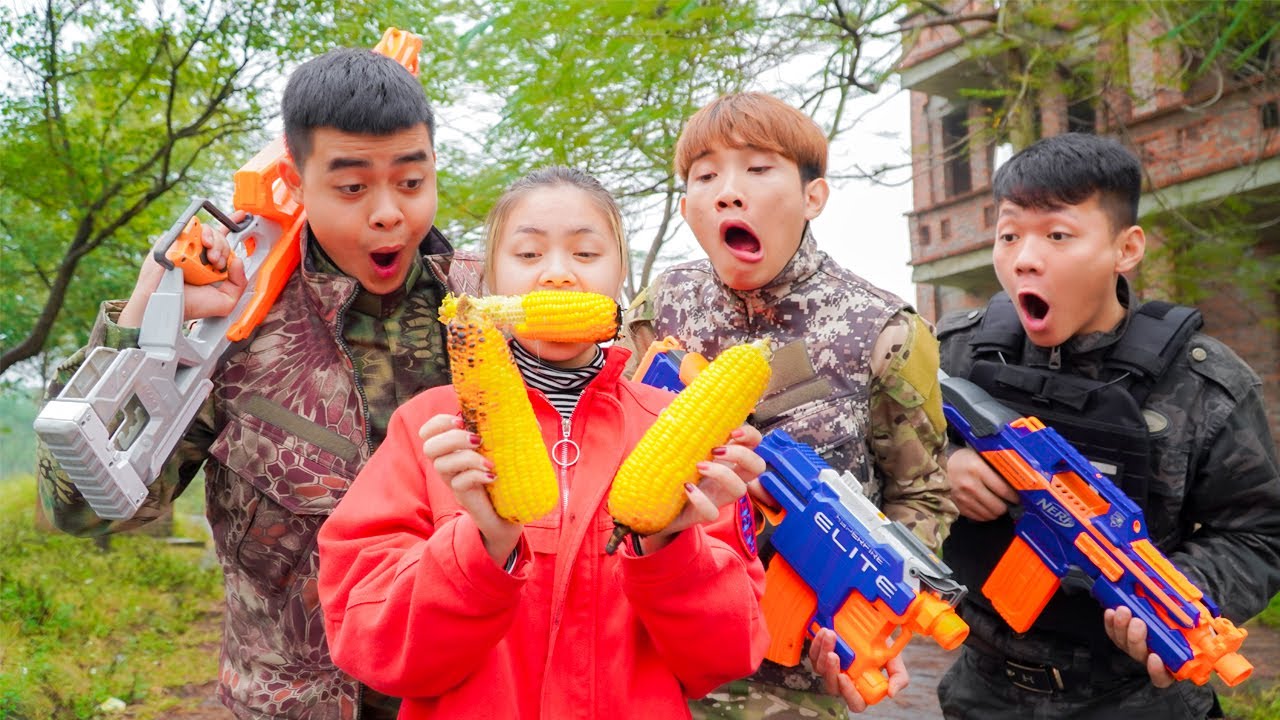 Nerf War: Couple SWAT Nerf Guns Robber Group Grilled Corn Battle