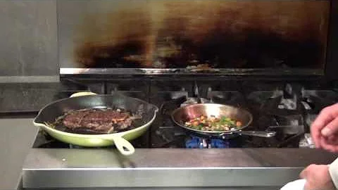 Dyrons Chef Randall Baldwin cooks steak in an iron...