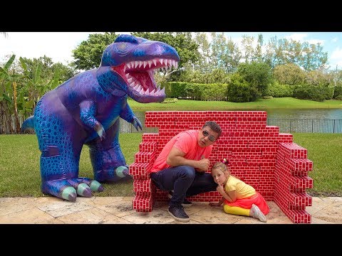 Stacy and Dad play with dinosaur