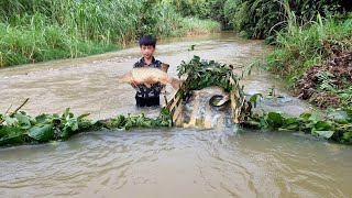The technique of blocking streams to create primitive fish traps.Orphan boy Nam catches fish to sell