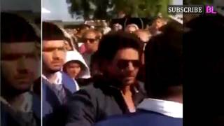 SHOCKING! Shah Rukh Khan hits back at a fan in public!