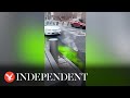 Bubbling green sludge leaks from New York City manhole cover in bizarre footage