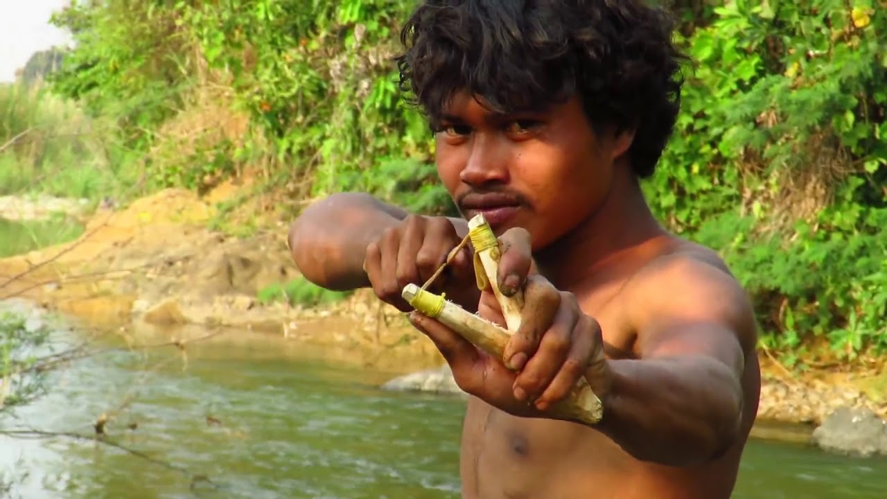 Primitive Technology   Tachybaptus ruficollis by catapult   grilled wild birds eating delicious