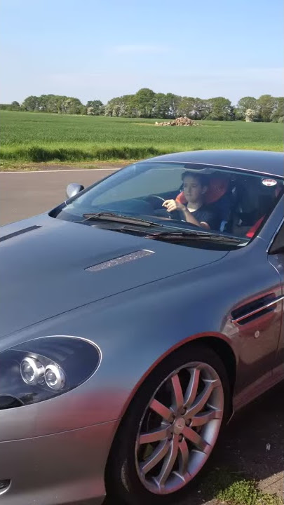 Charles Driving an Aston Martin (1)