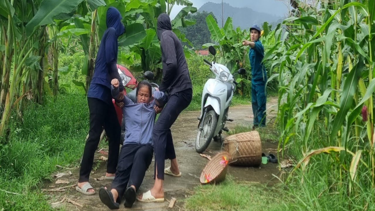 The kind policeman quickly saved the poor single girl from the hands of the bad guys.
