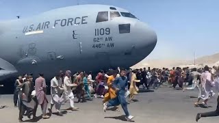 Watch: Afghans Run Alongside U.S. Military Plane At Kabul Airport