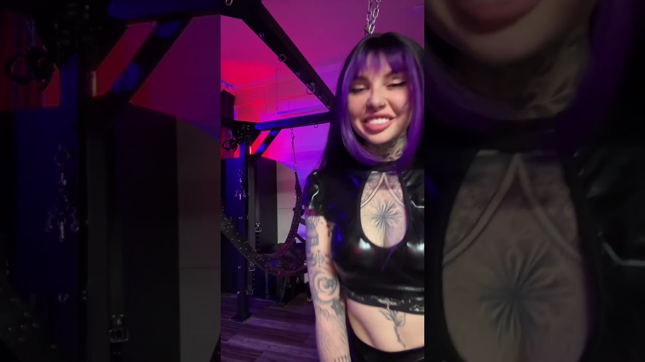 Shiny PVC, evil smile... Better watch out 😈