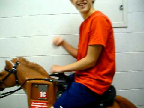 Collin Takes a Ride on the Meijer Horse