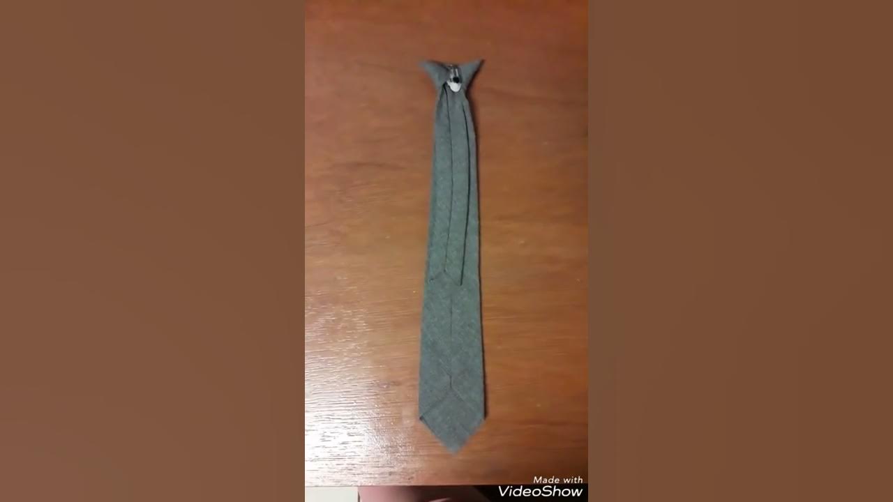 Cómo colocar corbata en un broche - YouTube