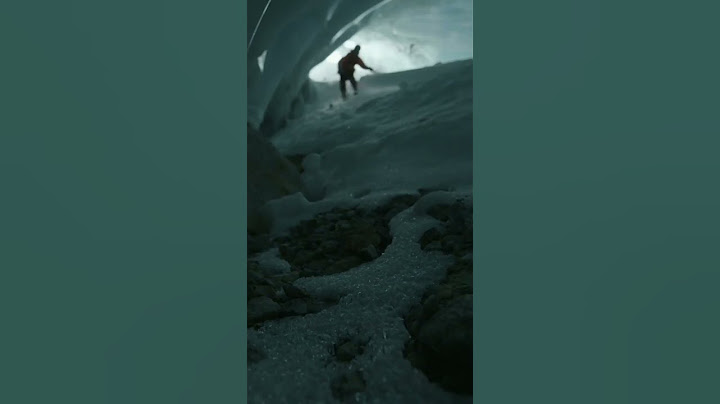 Exploring an ice cave on ski's