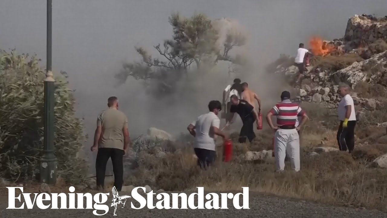 Rhodes residents fight wildfires with towels and branches