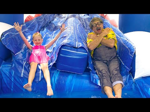 Nastya has fun at home on a large children's trampoline