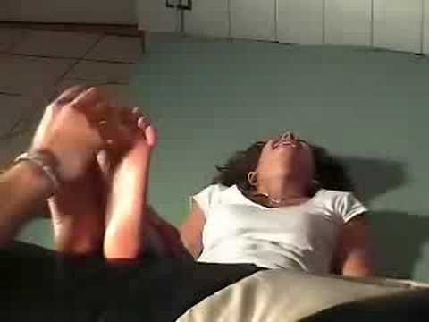 cute girl tickled on her bare feet