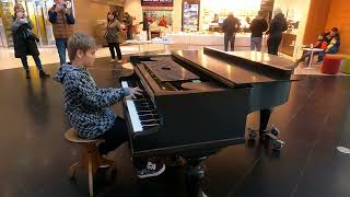 Playing popular songs on piano in public