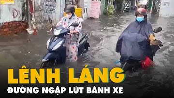 Đường ở Thủ Đức có đoạn ngập lút bánh xe vì mưa
