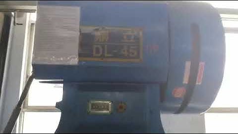 High speed brass button stamping line with roller feeder for feeding and pulling