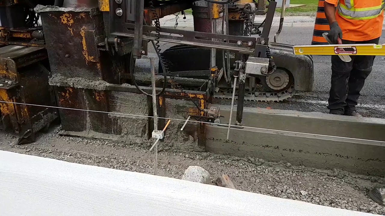 Highway Project - The Concrete Slipgorming Curb & Gutter Machine