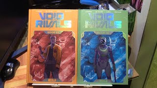 Void Rivals Deluxe Edition Book One Hardcover
buy on amazon - https://amzn.to/43dMsYD
The first year run of Void Rivals is now available in deluxe format! Pilots Darak and Solila from Agorria and Zertonia crash land on a desolate planet and are forced to work together to survive. An exciting start to the shared Energon universe! Void Rivals Deluxe Edition Book One Hardcover