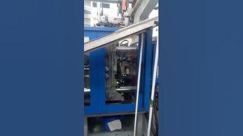 Yangsen robot working with 2-color injection molding machine.