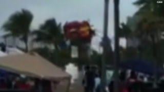 Watch: Bounce house thrown in air with kids inside