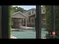 Video: Property owner builds fence through pool