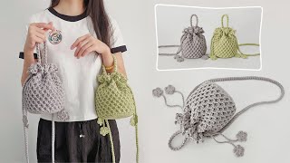 束口手腕包：脉络硬挺，实用斜挎