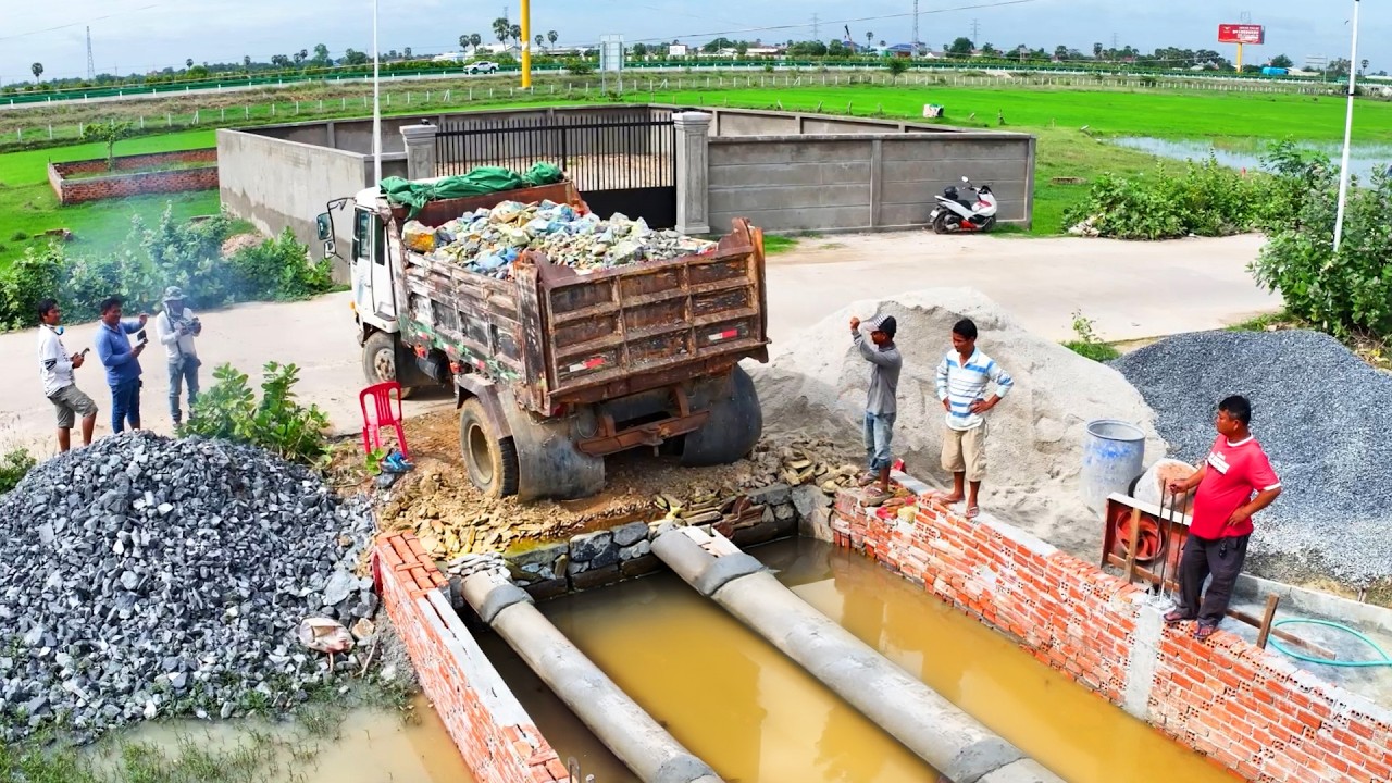 incredible delete drain build house  , truck transport stone soil , bulldozer push soil to water