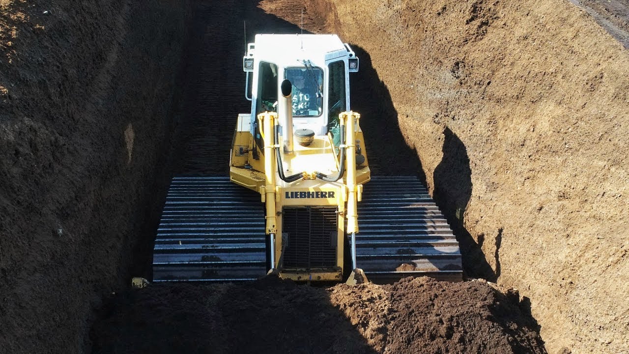 Slot Dozing Peat with a Liebherr PR712 LGP Dozer YouTube