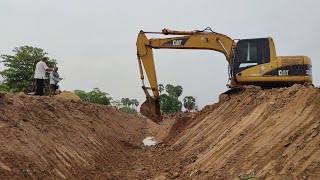 Cat 320 C Working in Village for Canal Water System 2020