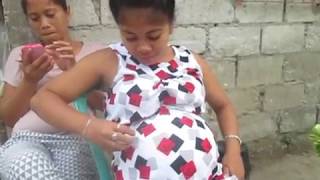 pregnant jacky lou outside on the street and shows belly